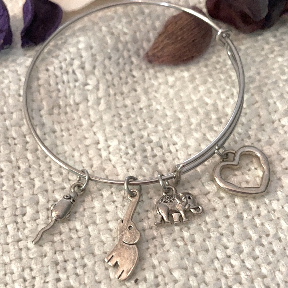 Expanding stainless bracelet Tibetan silver charms